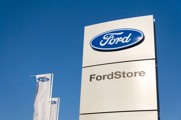 Ford motor company logo on dealership building — Stock Photo, Image