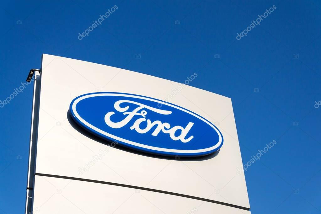 PRAGUE, CZECH REPUBLIC - SEPTEMBER 29: Ford motor company logo on dealership building on September 29, 2017 in Prague. Ford and Lyft will work together to deploy autonomous cars.
