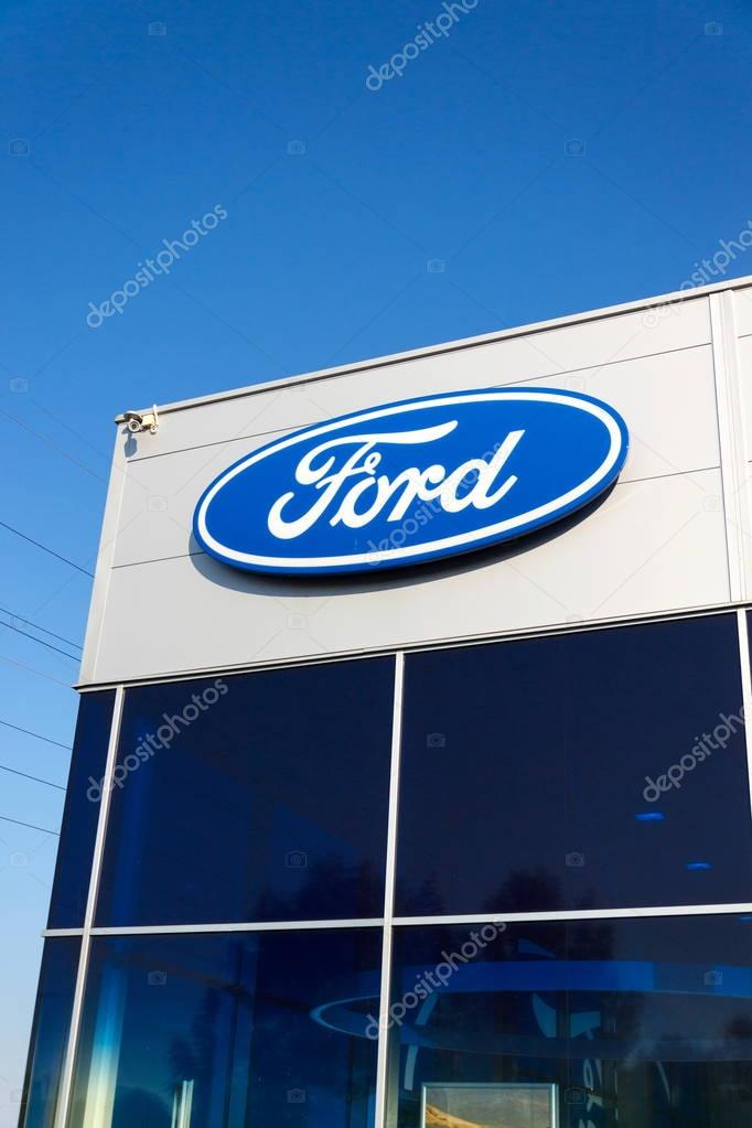 PRAGUE, CZECH REPUBLIC - SEPTEMBER 29: Ford motor company logo on dealership building on September 29, 2017 in Prague. Ford and Lyft will work together to deploy autonomous cars.