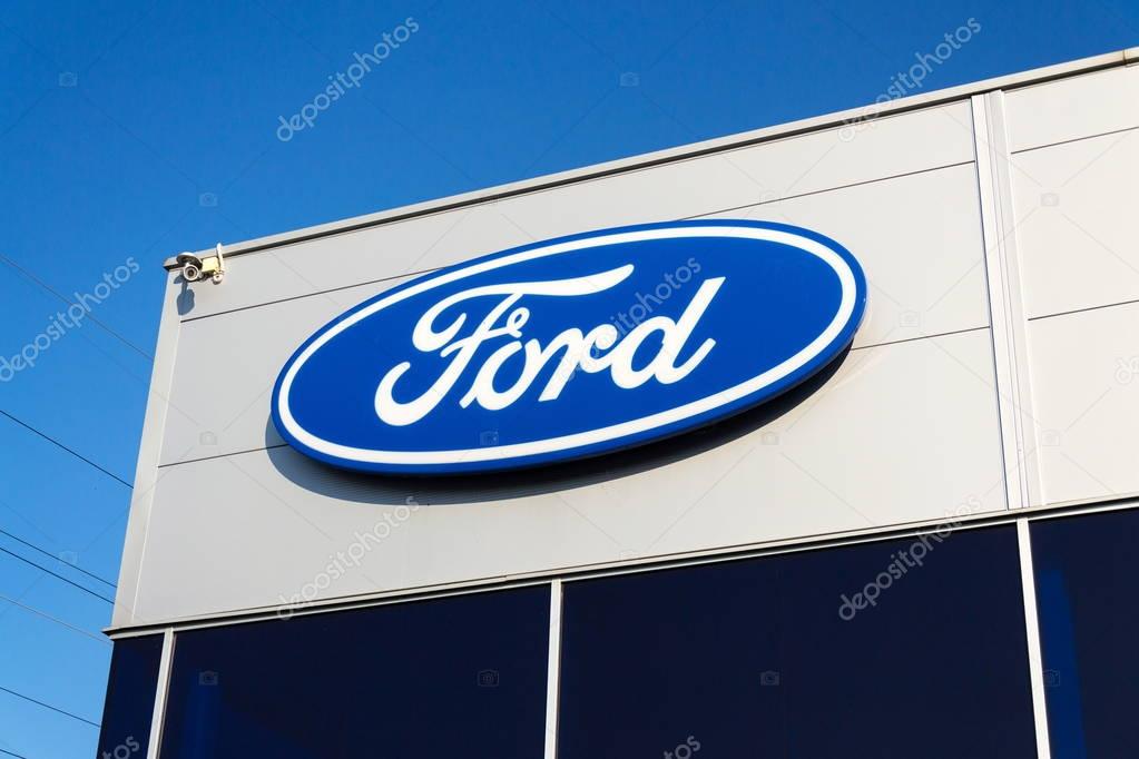 PRAGUE, CZECH REPUBLIC - SEPTEMBER 29: Ford motor company logo on dealership building on September 29, 2017 in Prague. Ford and Lyft will work together to deploy autonomous cars.