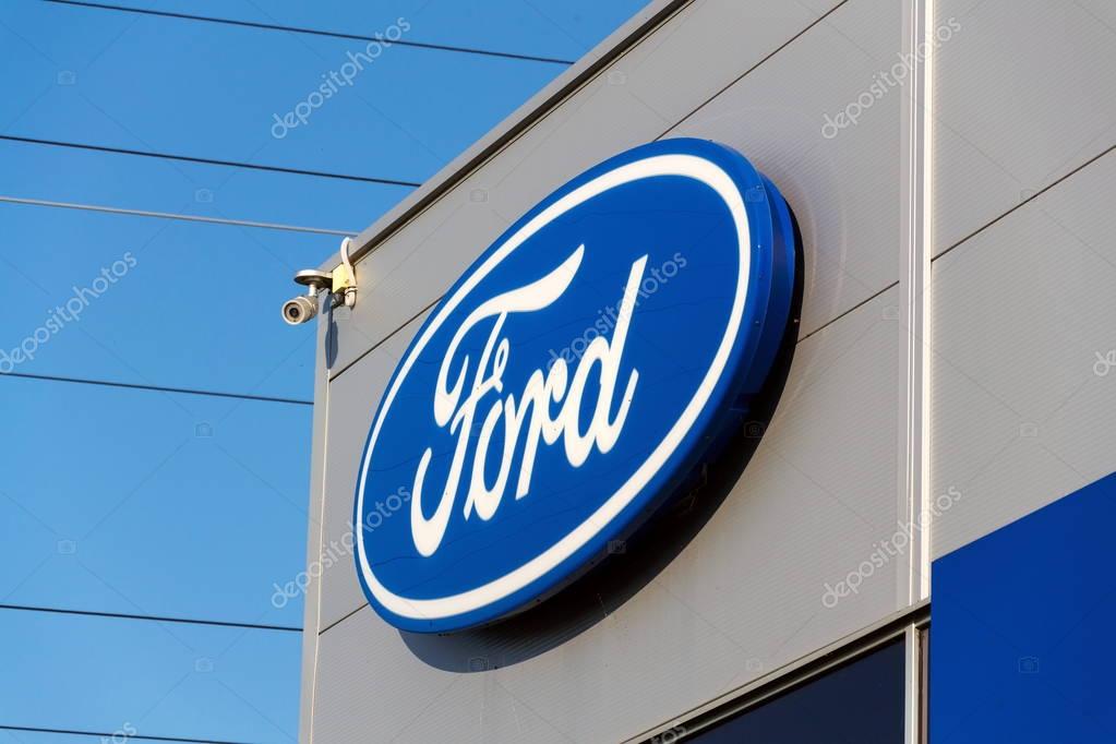 PRAGUE, CZECH REPUBLIC - SEPTEMBER 29: Ford motor company logo on dealership building on September 29, 2017 in Prague. Ford and Lyft will work together to deploy autonomous cars.