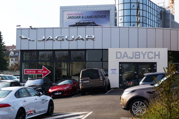 Jaguar car manufacturer company logo in front of dealership building — Stock Photo, Image