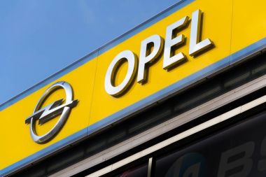 Opel company logo on dealership building  clipart