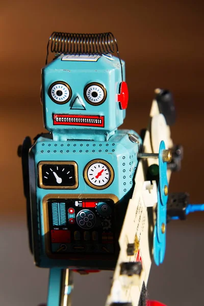 Angry Vintage Tin Toy Robot Carries Green Computer Circuit Board — Stock Photo, Image