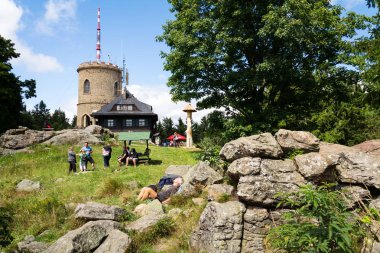 KAJOV, CZECH REPUBLIC - AUGUST 12: People on the oldest Czech stone lookout tower - Josefs lookout tower at Mount Klet in Blansky forest on August 12, 2017 in Kajov, Czech Republic. clipart