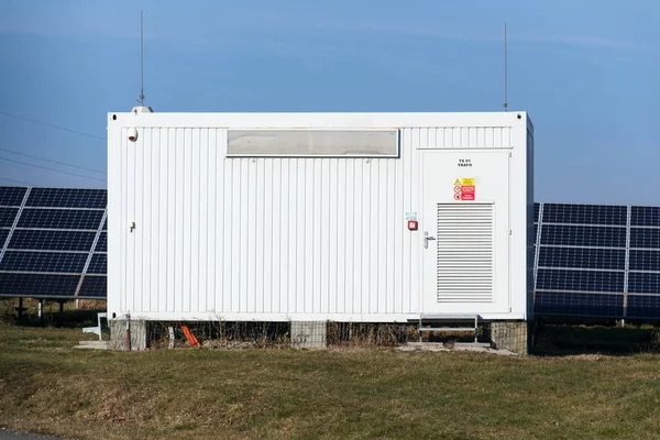 Distribution point at solar panels photovoltaics power station farm, future innovation energy concept, clear blue sky background, Czech Republic