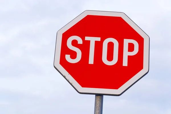 Stop traffic sign with blue clear sky background copy space