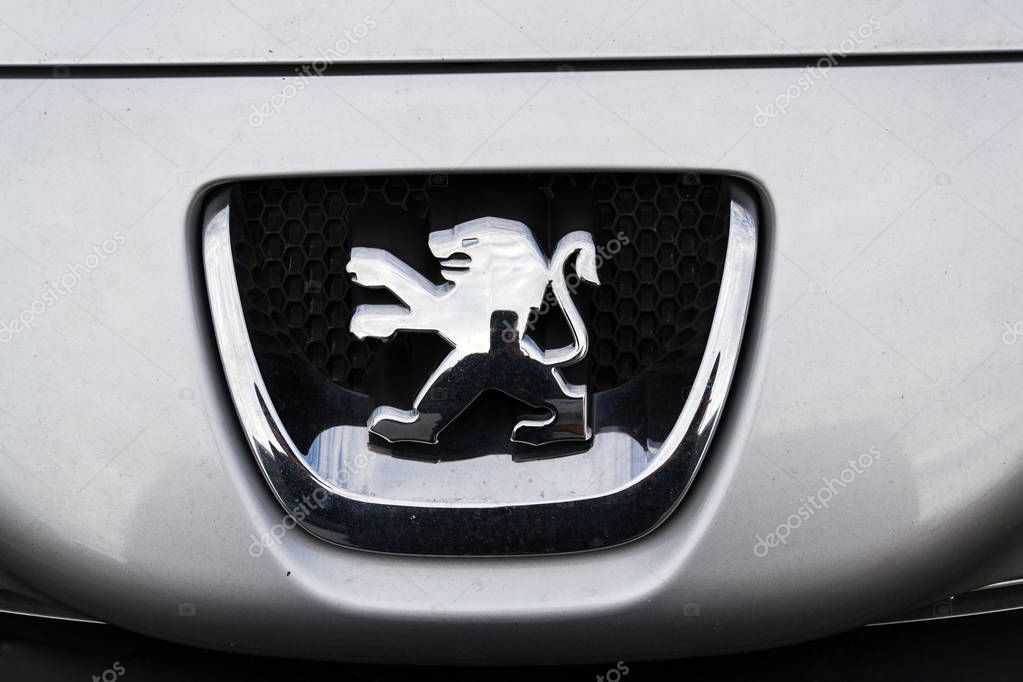 PRAGUE, CZECH REPUBLIC - MARCH 9 2018: Peugeot company logo on silver car on March 9, 2018 in Prague, Czech Republic.