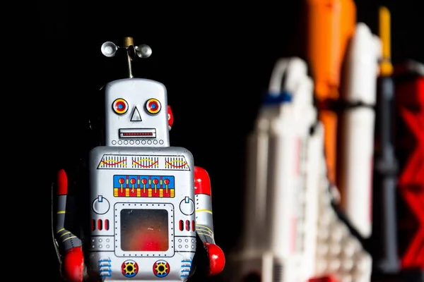 Vintage Tin Toy Robot Looking Future Space Exploration Rocket Background — Stock Photo, Image