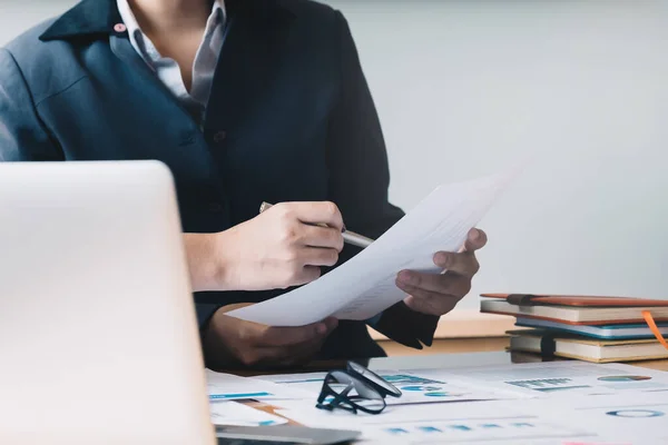 close up hand of marketing manager employee pointing at business document during discussion at meeting room