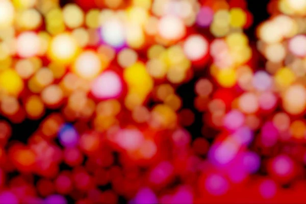 Bokeh and abstract background of celebration, party, Christmas vibes, New Years, or any anniversary and fun theme with dim, blurred,  vivid light bulbs and flare. Double images.