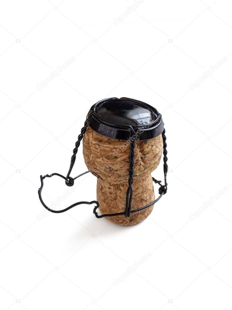 Champagne cork, with a wire muselet and a black metal lid