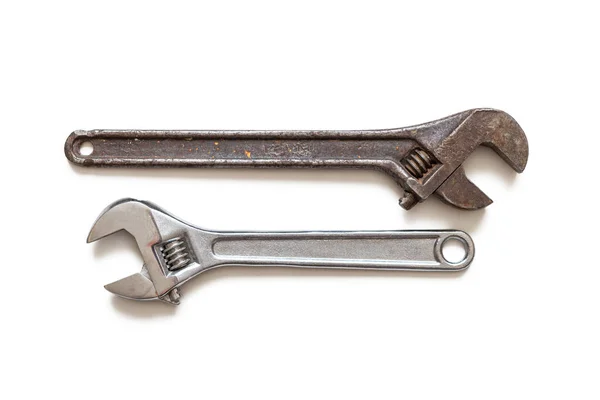 Metal adjustable wrenches, old and new, on white background — ストック写真