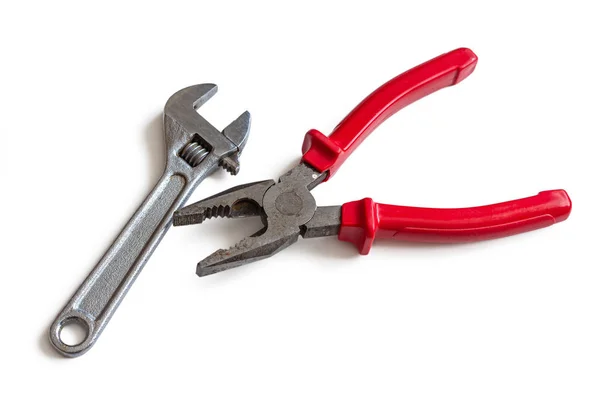Pliers with a small wrench, on a white background — ストック写真