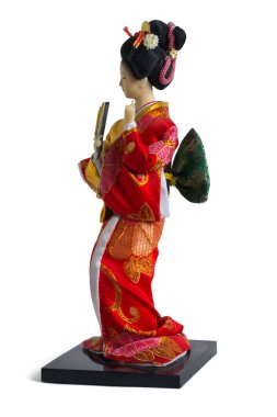 Kırmızı kimonolu oyuncak Japon kız.