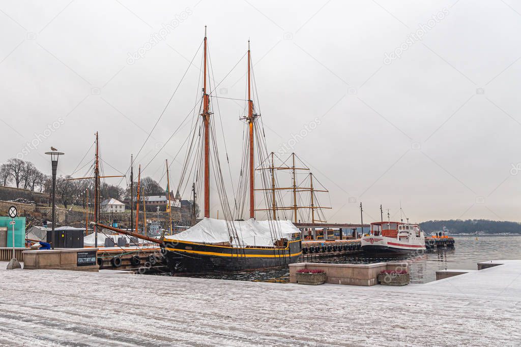 Winter Parking of ships with masts moored to the sea pier