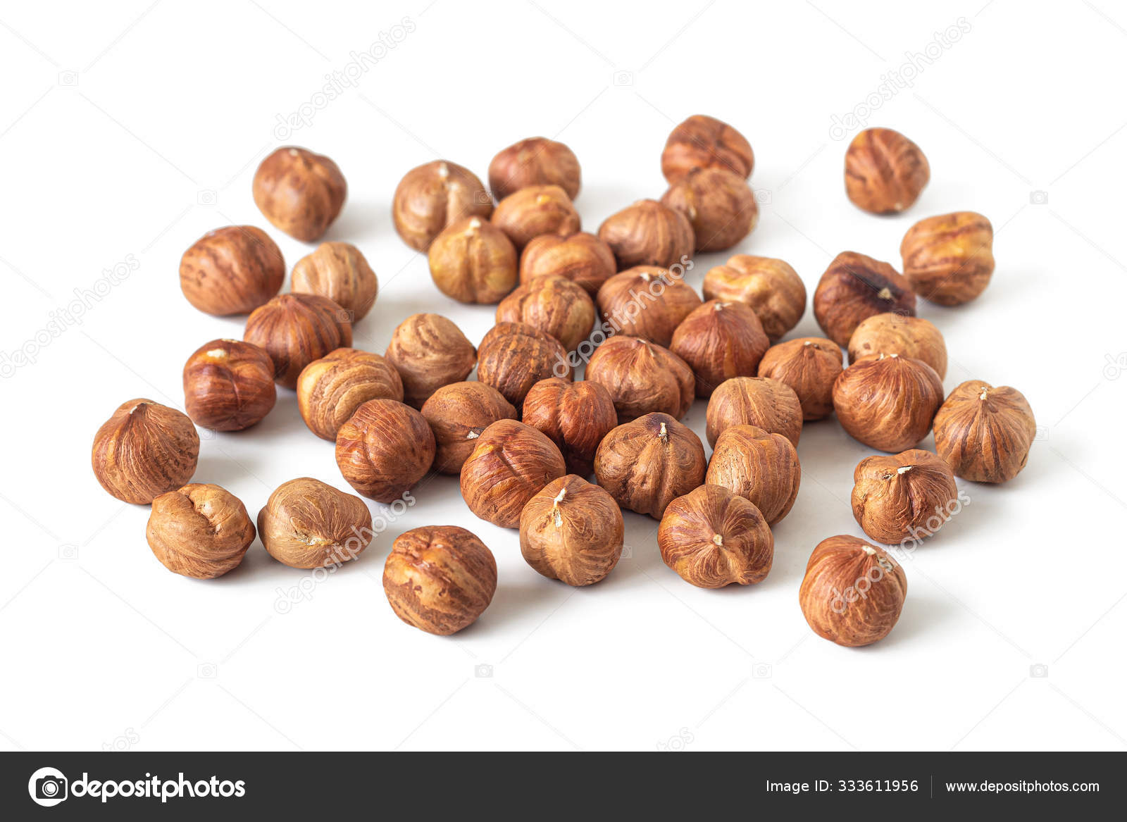 Handful of peeled hazelnuts with a textured skin — Stock Photo