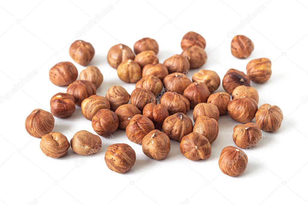 Handful of peeled hazelnuts with a textured skin