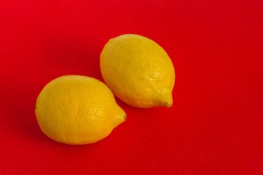 Red felt fabric and yellow lemons