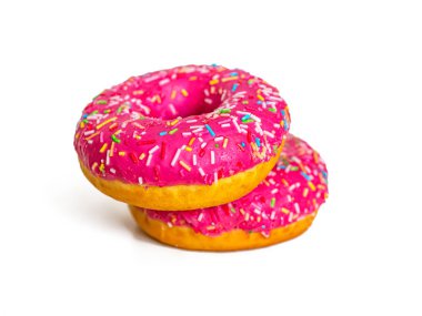 Two bright pink doughnuts with strawberry frosting