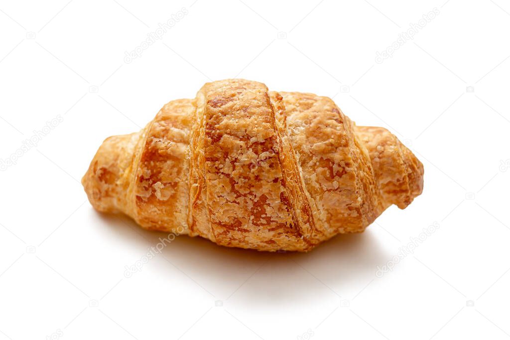 Fresh French croissant with Golden crust, from the bakery, isolated on a white background