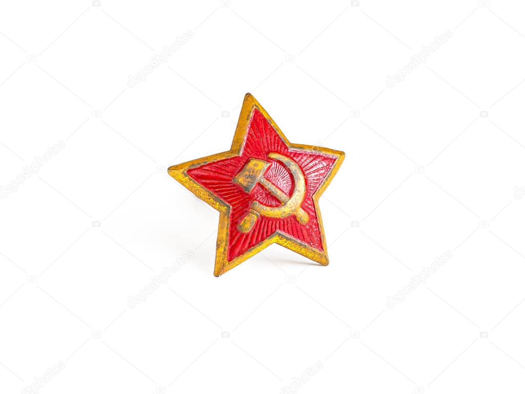 Old army red star made of metal for a headdress isolated on a white background