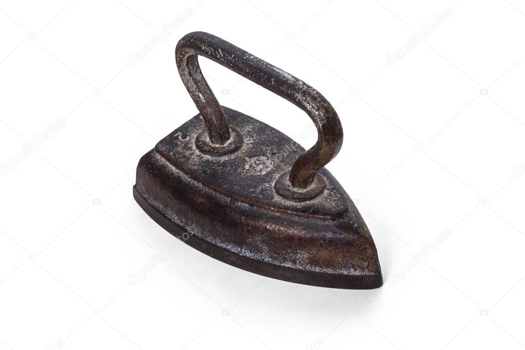 Very old iron for Ironing, vintage heavy iron. Isolated on white background