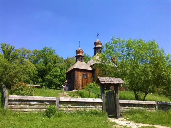 Hilly area of the park / museum Ukrainian Village of the 17th century with houses, churches, mills of the time