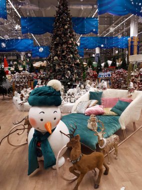  close-up of abstract, bright, Christmas background from garlands, Christmas tree, decorations, snow, berries and fruits, toys, ice