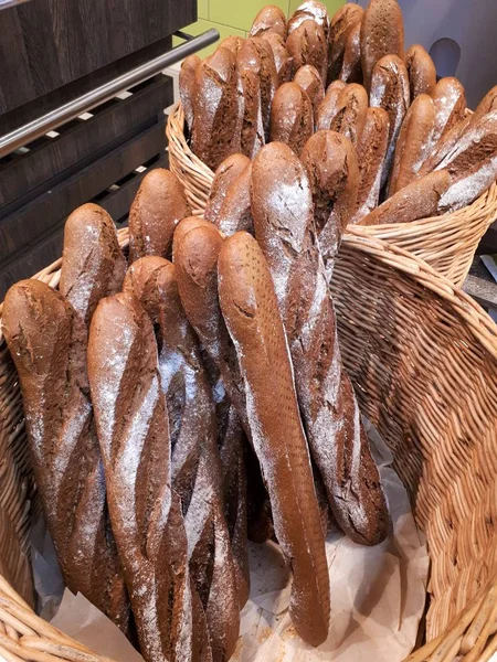 close-up of freshly baked baguettes in wicker baskets