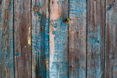 Painted in blue and grey wooden damaged texture, wallpaper and background, close-up