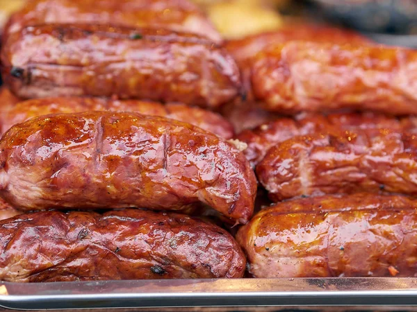 Background texture a delicious fried sausages — Stock Photo, Image