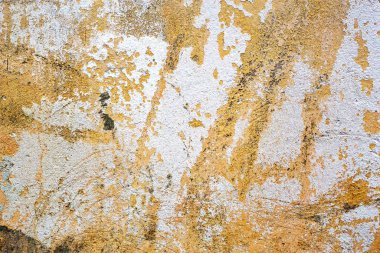 Sarı ve beyaz beton ile boyanmış eski hasarlı doku, duvar kağıdı ve arka plan, yakın plan.