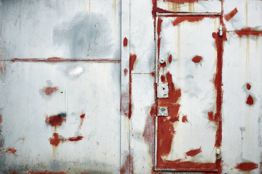 Painted in white and red old damaged iron door and wall texture, wallpaper and background