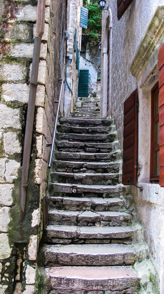 Steep stairs on a narrow street in the old town area of Kotor city, Montenegro