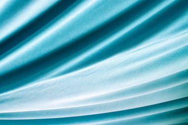 Turkuaz doğal kumaş. Yumuşak pliseli, arka plan..
