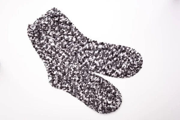 Grey motley cozy winter socks on white background — Stok fotoğraf