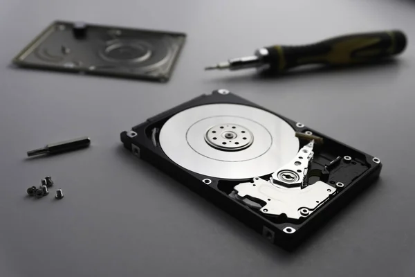 Close up of hard disk's internal mechanism hardware. Soft focus — Stock Photo, Image