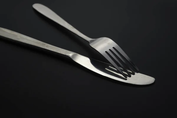 Fork and spoon on dark background, Restaurant concept. — Stock Photo, Image