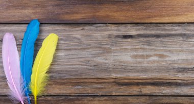 colored writing pens on a wooden old background