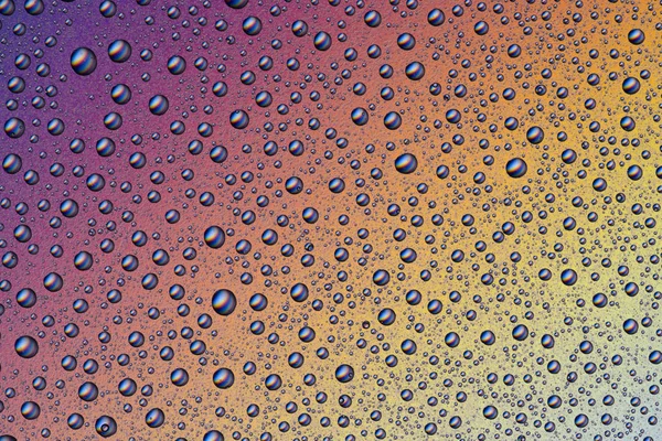 Background of water drops on colorful surface — Stock Photo, Image