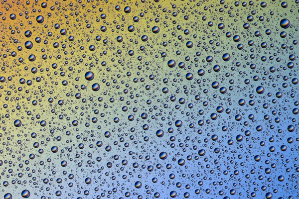 Background of water drops on colorful surface — Stock Photo, Image