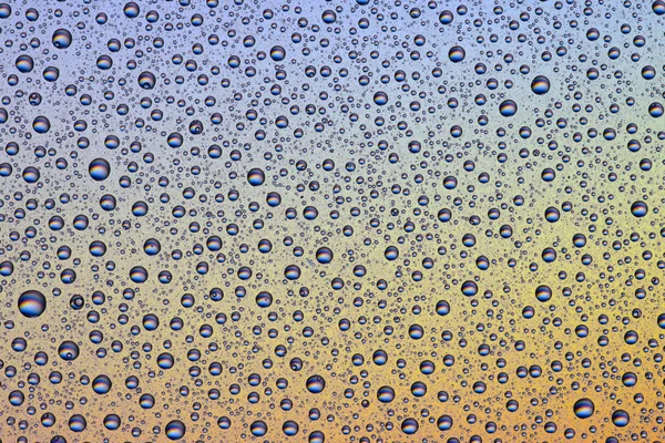 Fondo de gotas de agua en la superficie colorida — Foto de Stock