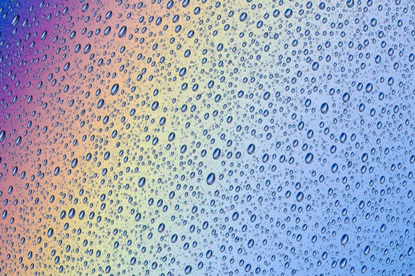 Tło z kropli wody na powierzchni kolorowy — Zdjęcie stockowe