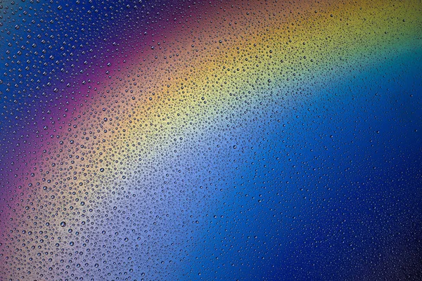 Fond de gouttes d'eau sur une surface colorée — Photo