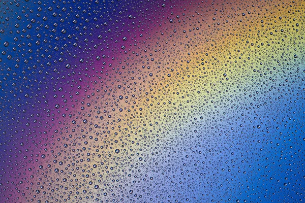 Latar belakang tetes air pada permukaan penuh warna — Stok Foto