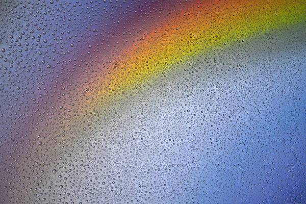 Fond de gouttes d'eau sur une surface colorée — Photo