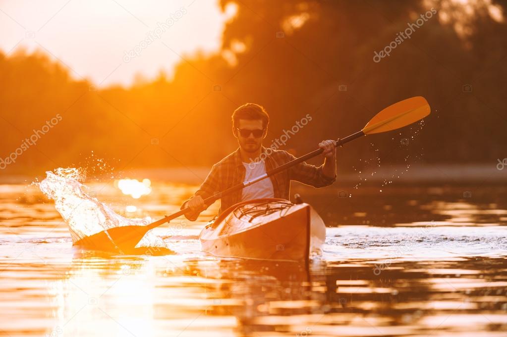 young man kayaking 
