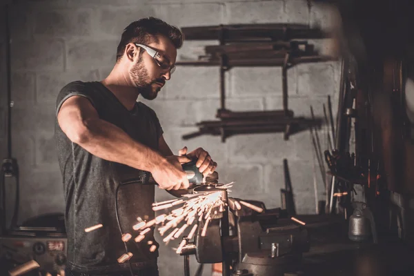 Handsome welder in garage — Stock Photo, Image