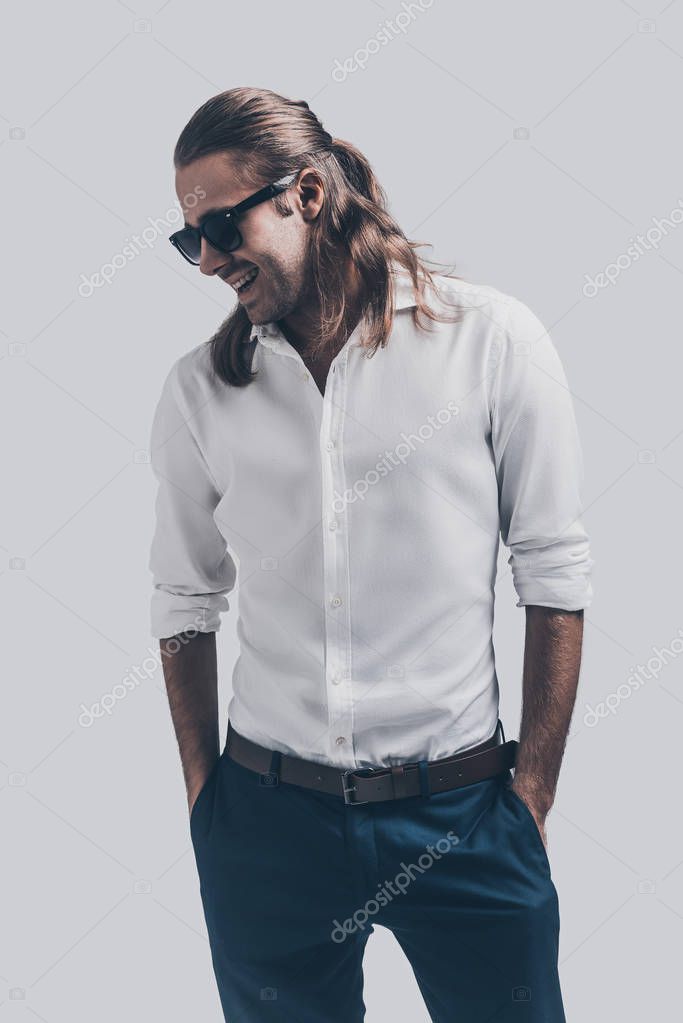 Stylish and handsome man with long hair Stock Photo by ©gstockstudio  129316512